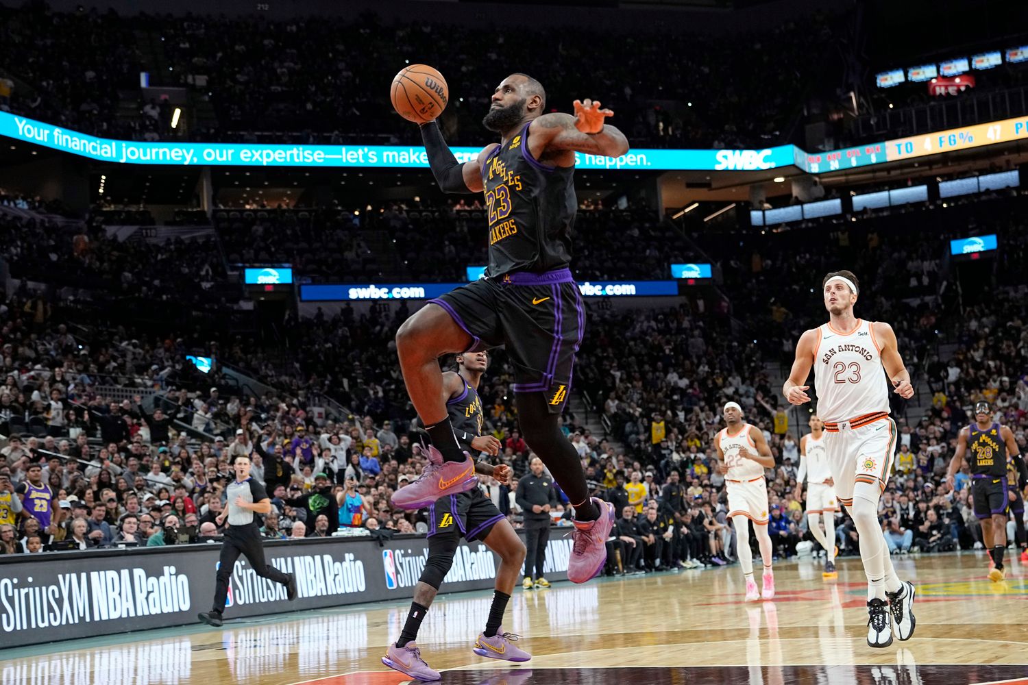 Dec 15, 2023; San Antonio, Texas, USA; Los Angeles Lakers guard LeBron James (23) goes up for a dunk during the second half against the San Antonio Spurs at Frost Bank Center.